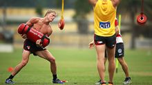 SYDNEY, AUSTRALIA - DECEMBER 05:  Isaac Heeney performs strength drills during a Sydney Swans AFL pre-season training ...