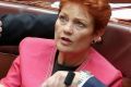 Senator Pauline Hanson in discussion with Minister for Finance and Special Minister of State Senator Mathias Cormann and ...