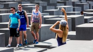 Tourists taking photos at the Holocaust Memorial in Berlin.