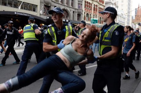 Five people were arrested as police moved to remove the homeless people from Flinders Street on Wednesday. 