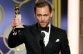 Tom Hiddleston with the award for best actor in a limited series or TV movie for <i>The Night Manager</i> at the 2017 ...