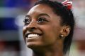 RIO DE JANEIRO, BRAZIL - AUGUST 07:  Simone Biles of the United States smiles before competing on balance beam during ...