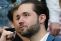 Alexis Ohanian, fiance of United States' Serena Williams, makes a fist while watching Serena play her sister, Venus, in ...
