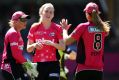 Garth Vader: Kim Garth celebrates a wicket with her Sixers teammates. 