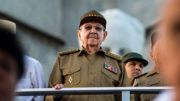 Cuba's President Raul Castro watches a parade in honor of his late brother Fidel Castro in Revolution Square in Havana, Cuba, Monday, Jan. 2, 2017. Soldiers, students and people marched in a show of solidarity and homage to Castro who died in November of last year. (AP Photo/Desmond Boylan)