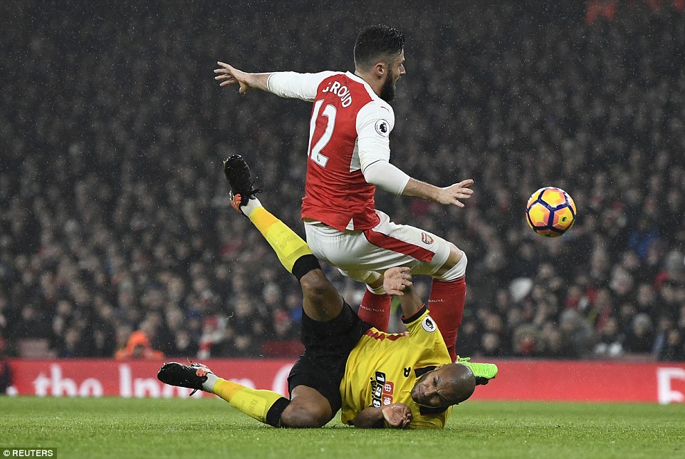 Kaboul takes an unorthodox approach to tackling as he goes in for the ball on Arsenal's Olivier Giroud