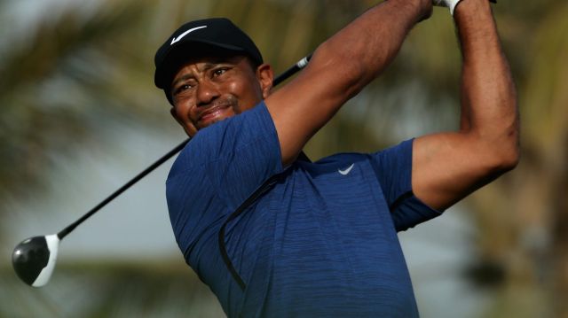 Doing it tough in the desert: Tiger Woods.