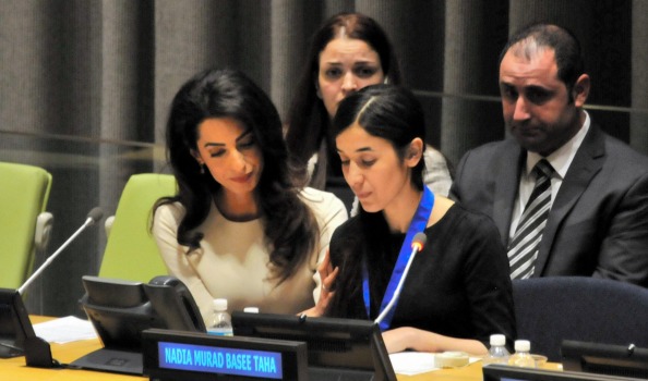 Yazidi woman and suvivor of the Islamic State's brutality, Nadia Murad Basee Taha speaks while attorney Amal Clooney ...