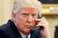 US President Donald Trump speaks on the phone with Prime Minister of Australia Malcolm Turnbull in the Oval Office of ...