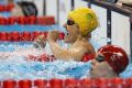 Ellie Cole celebrates winning the gold medal in the women's 100m backstroke S9.