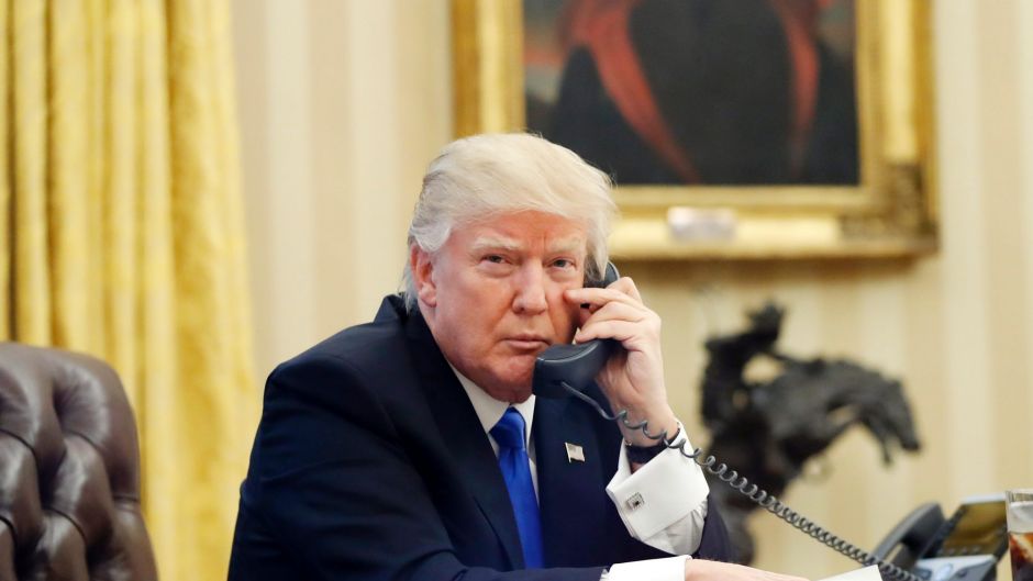 US President Donald Trump speaks on the phone with Prime Minister of Australia Malcolm Turnbull in the Oval Office of ...