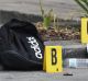 A meat cleaver, a box cutter, a kitchen knife and a pair of scissors were found next to the black Adidas bag.