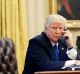 US President Donald Trump speaks on the phone with Prime Minister of Australia Malcolm Turnbull in the Oval Office of ...