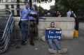 A young couple painted as EU flags protest on outside Downing Street against the United Kingdom's decision to leave the EU. 