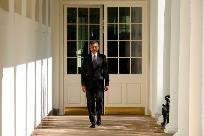 Barack Obama walks the Colonnade toward the Oval Office