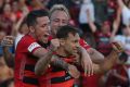 Relief: Brendon Santalab, Mitch Nichols and Scott Neville celebrate the fourth goal.