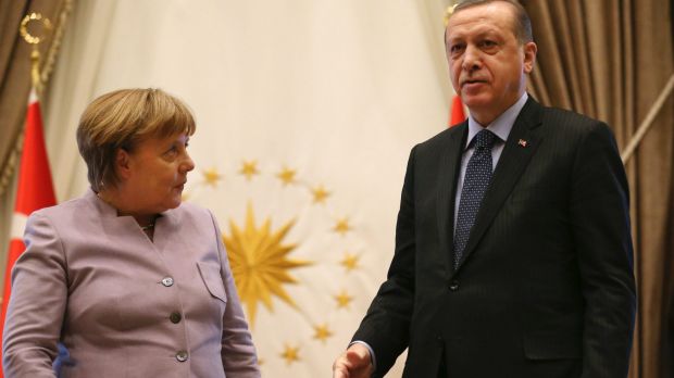 Turkish President Recep Tayyip Erdogan, right, and German Chancellor Angela Merkel leave at the end of a press statement ...