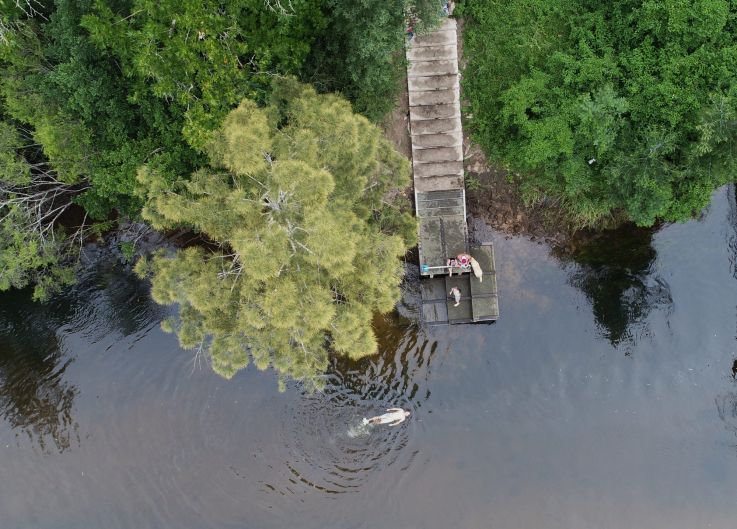 A swimmer enjoys the Colo River in Sydney's west during another hot day.