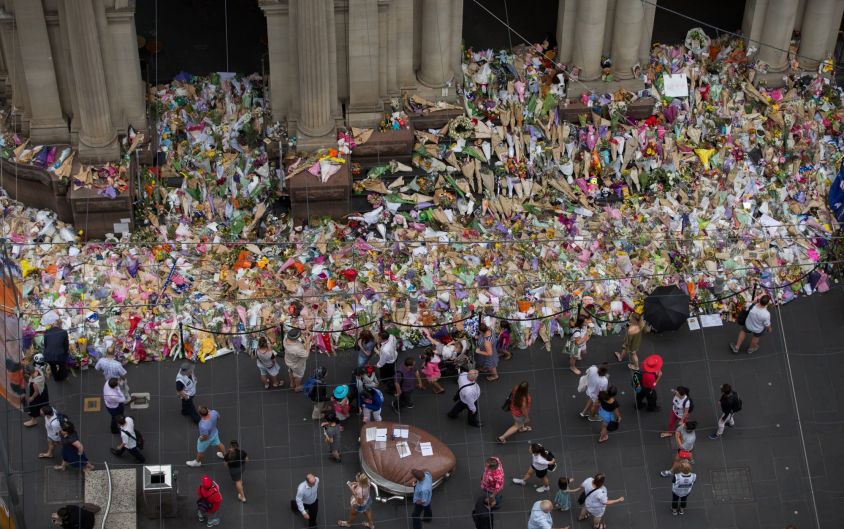 The makeshift floral memorial commemorating the lives of the victims of the Bourke Street attack.