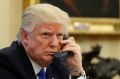 President Donald Trump speaks on the phone with Prime Minister of Australia Malcolm Turnbull in the Oval Office of the ...