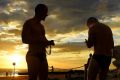 Swimmers rinse off at Clovelly Beach before the temperatures rise in Sydney on Tuesday morning.