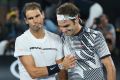 Great players, great men: Rafael Nadal congratulates Roger Federer on his Australian Open triumph. 