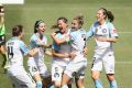 Laura Alleway and Melbourne United celebrate after scoring a goal in round 2 against Canberra United.