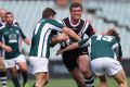 Rugby rumble: Magpies prop Ray Cashmere is tackled by the Randwick defence at Pirtek Stadium.