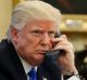 President Donald Trump speaks on the phone with Prime Minister of Australia Malcolm Turnbull in the Oval Office of the ...