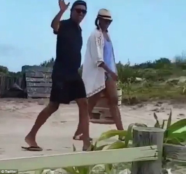 Happy: During day eight of their tropical vacation, the Obamas were carefree and upbeat as they enjoyed the day 