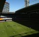 Neither here nor there: the half-open Etihad Stadium roof during Saturday's game.