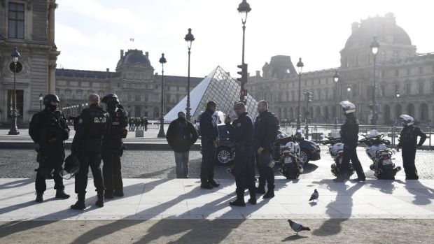 Armed police surround the Louvre on Friday morning.