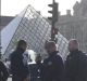 Armed police surround the Louvre on Friday morning.