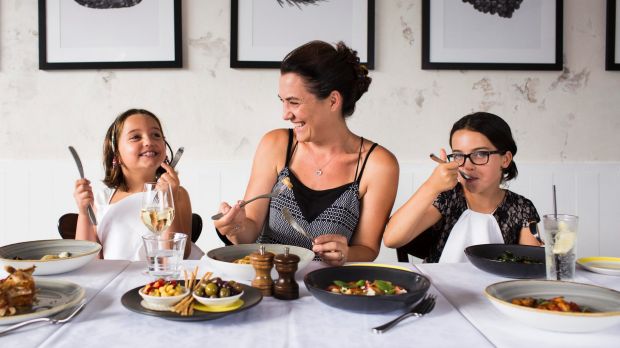 Julia Lipari and her daughters, Isabella (left) and Lily (right) dig in at  Otto in Woolloomooloo.