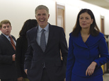 Supreme Court nominee Judge Neil Gorsuch, center, arrives with former New Hampshire Sen. Kelly Ayotte on Capitol Hill in Washington, Thursday, Feb. 2, 2017, for a meeting with Sen. Bob Corker, R-Tenn.  (AP Photo/Susan Walsh)