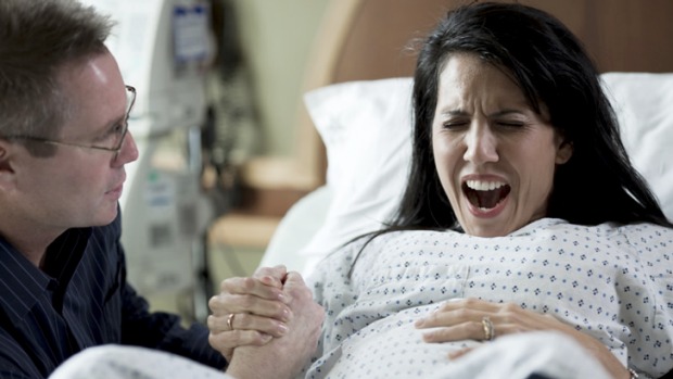 Woman screaming in childbirth, labour.