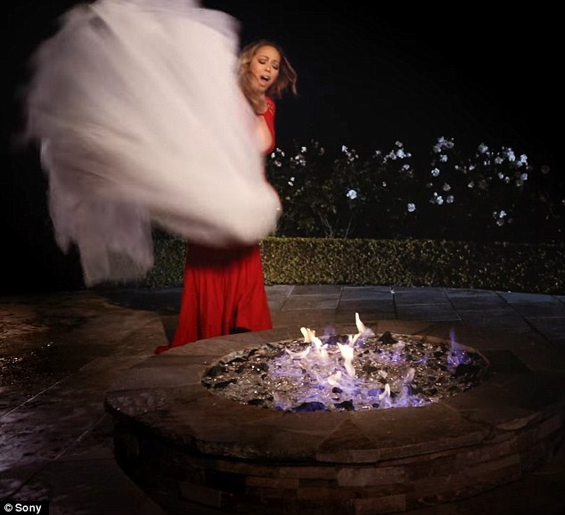 Are you watching James Packer? Mariah Carey burns her wedding dress in steamy I Don't music video