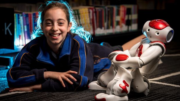 Grade 4 student Romy Szmulewicz with robot Rosie at the Bialik College.