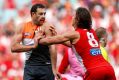 Fiery clash: Kurt Tippett and Shane Mumford wrestle during the 2016 AFL First Qualifying Final between the Sydney Swans ...
