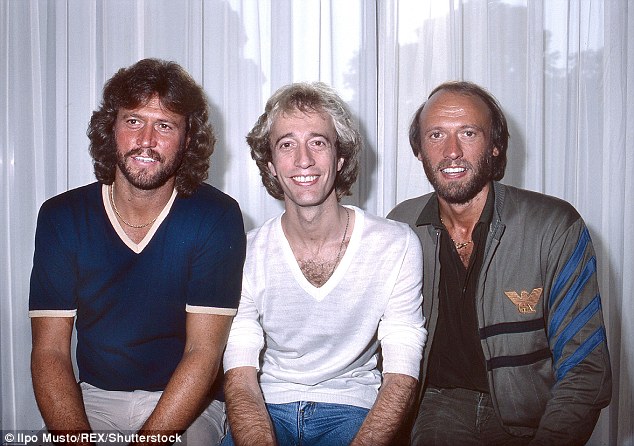 Barry Gibb, Robin Gibb and Maurice Gibb promoting the Staying Alive soundtrack in 1983