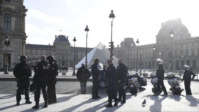 Armed police surround the Louvre on Friday morning.