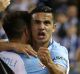 City's Tim Cahill celebrates after scoring in round two against Victory.