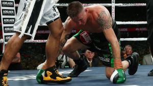 The fight almost ended after 30 seconds after a cheap shot from Mundine.