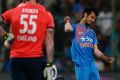 Six wicket haul: Yuzvendra Chahal celebrates the dismissal of England's Ben Stokes.