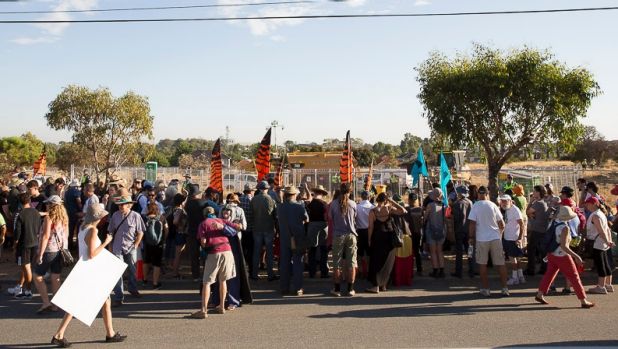 The community protests at the Roe 8 site.