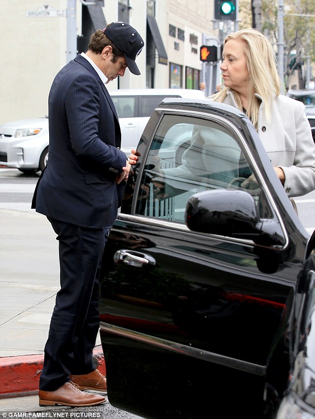Gentleman: Benicio Del Toro, 49, was snapped leaving the Beverly Hills restaurant E Baldi Friday, holding his car door open for a beautiful female friend