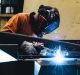 Companies that employ trade workers like welders and mechanics are increasingly joining with community colleges, ...
