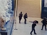 A grainy picture claims to show the immediate aftermath of this morning's shooting, after a machete-wielding man attacked four soldiers outside the Louvre, which houses many of the world's most famous paintings, including the Mona Lisa