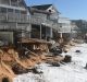 High tide begins to impact on damaged beachfront homes along Pittwater Road at Collaroy on the northern beaches of Sydney.