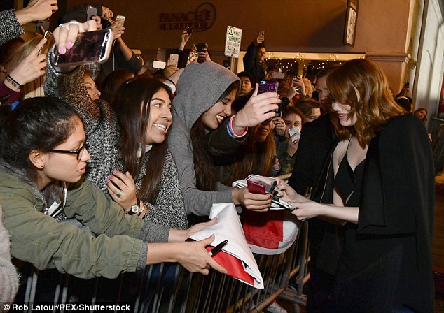 Fan-atical! The Superbad actress made time to stop and sign autographs for the masses of admirers 